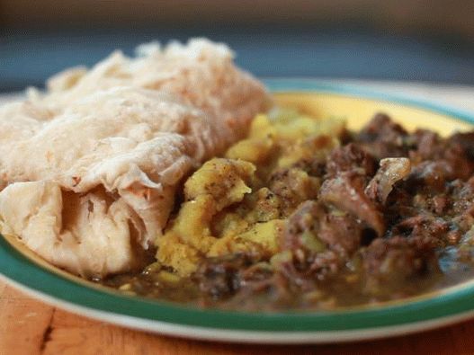 Fotografia cărnii de capră în stil Trinidad în sos de curry